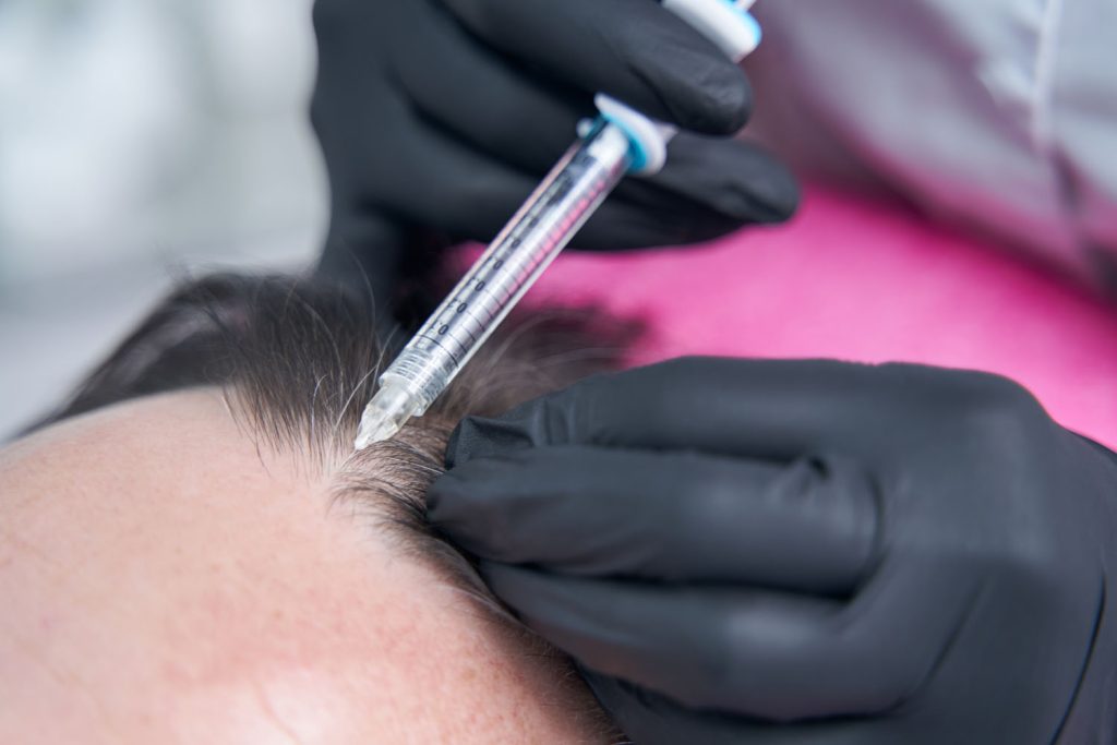 close up of syringe being in female hand 2026 03 23 22 59 36 utc
