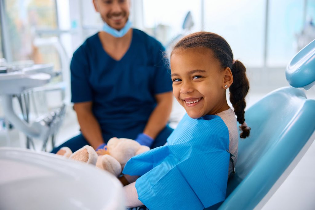 happy black little girl during teeth check up at d 2026 01 06 10 28 48 utc