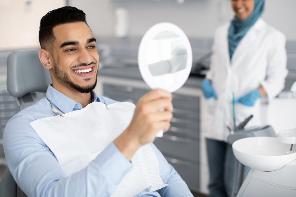 happy handsome arab man looking to mirror after te 2026 01 08 23 04 37 utc
