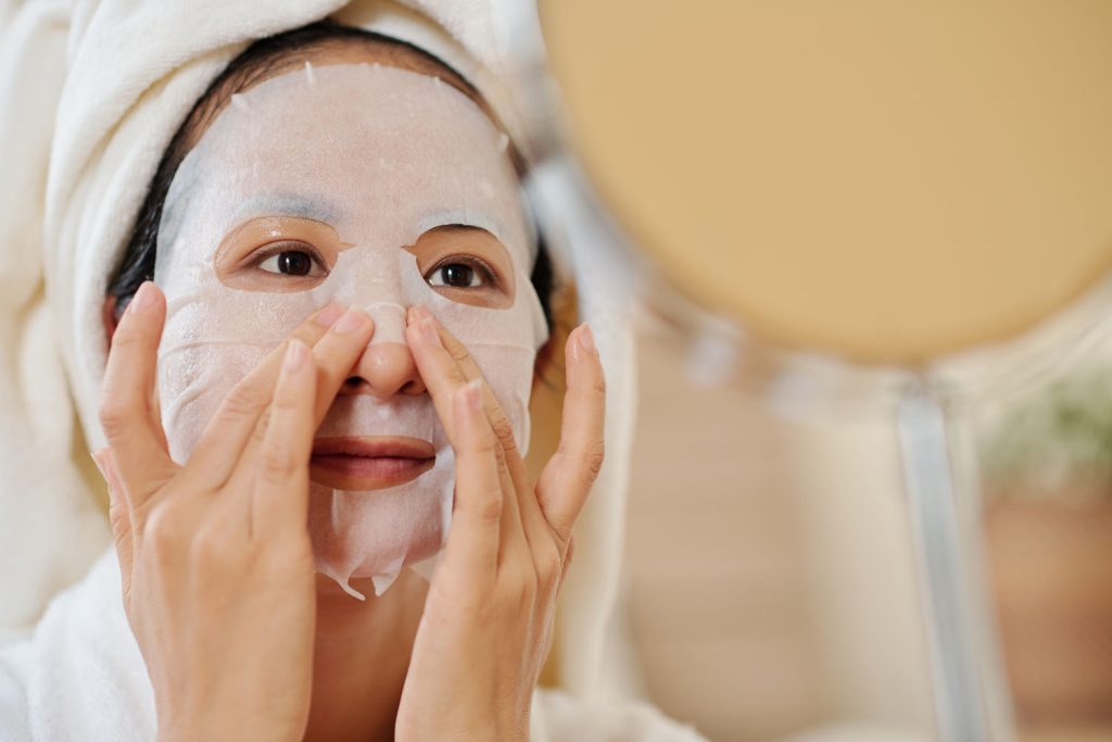 woman applying resurfacing sheet mask 2026 01 07 07 10 21 utc