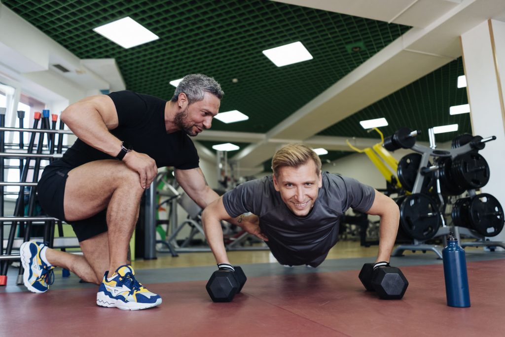 personal sport coach training his client in the gy 2026 03 09 21 49 49 utc