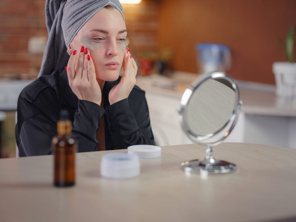 young woman applies patches under eyes beauty and 2026 03 17 06 29 55 utc