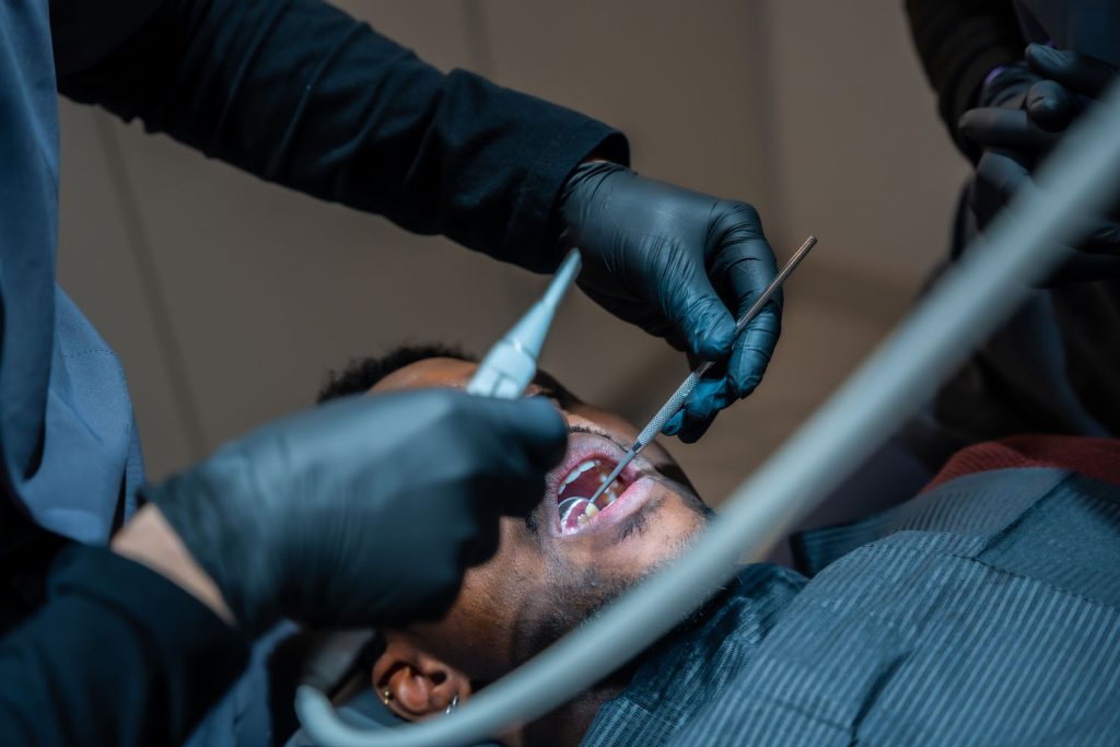 dentist performing dental checkup on patient in cl 2026 03 20 03 43 22 utc