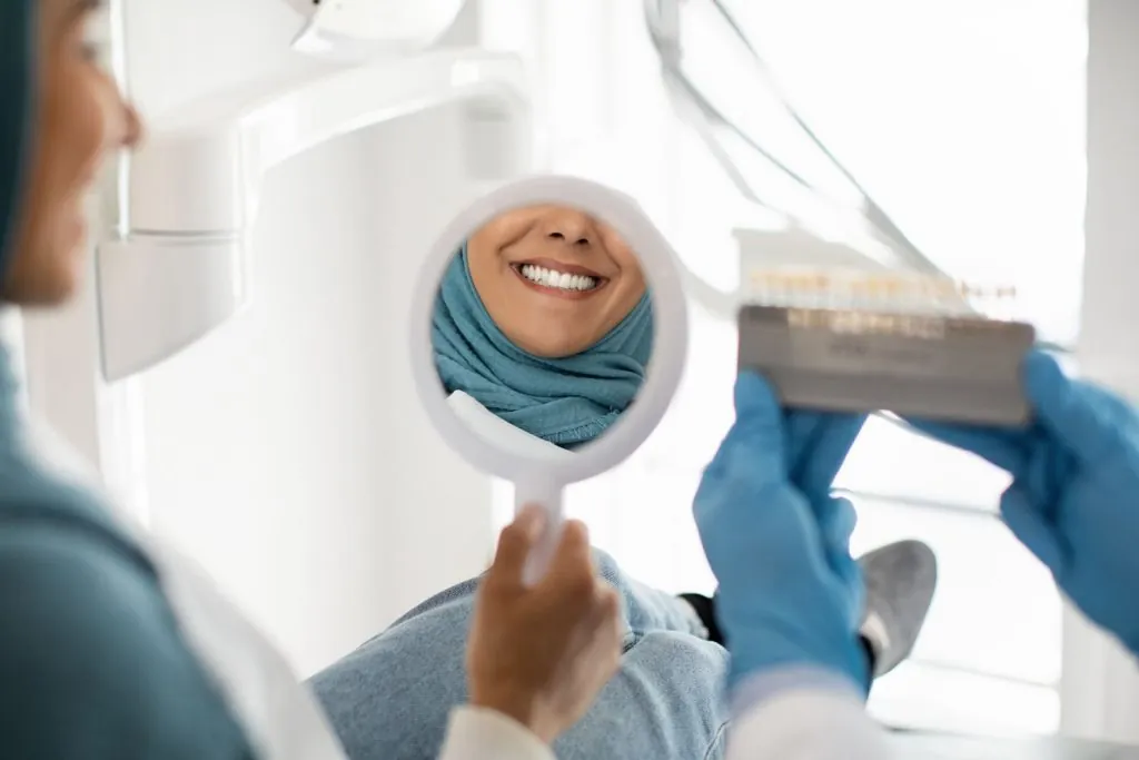 beautiful muslim woman in hijab looking at mirror 2026 03 24 02 22 16 utc