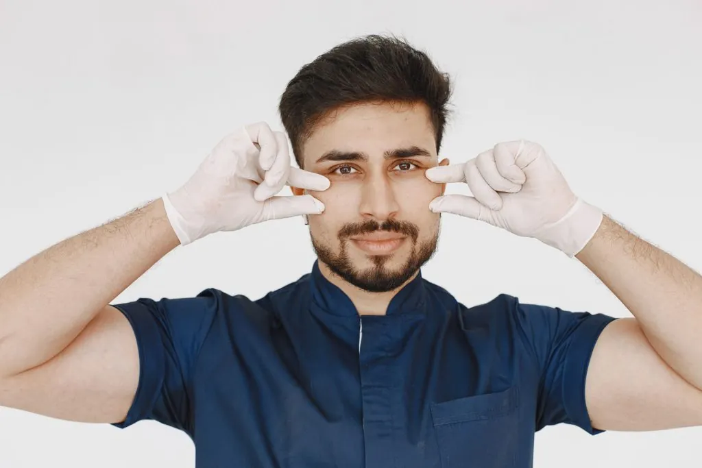 a portrait of a medical doctor posing against whit 2026 03 17 07 19 48 utc