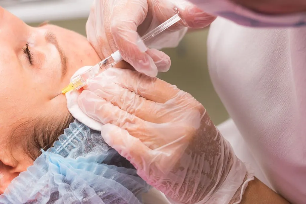 close up of hands of young cosmetologist injecting 2026 03 24 11 38 53 utc 1