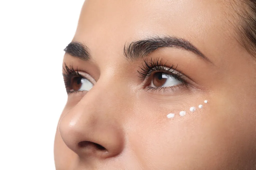 woman with eye cream on white background closeup 2026 01 22 02 27 41 utc