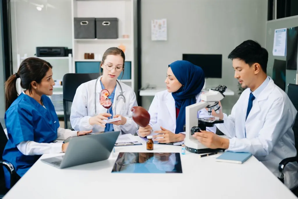 medical meeting and laptop for team in discussion 2026 01 05 23 25 12 utc