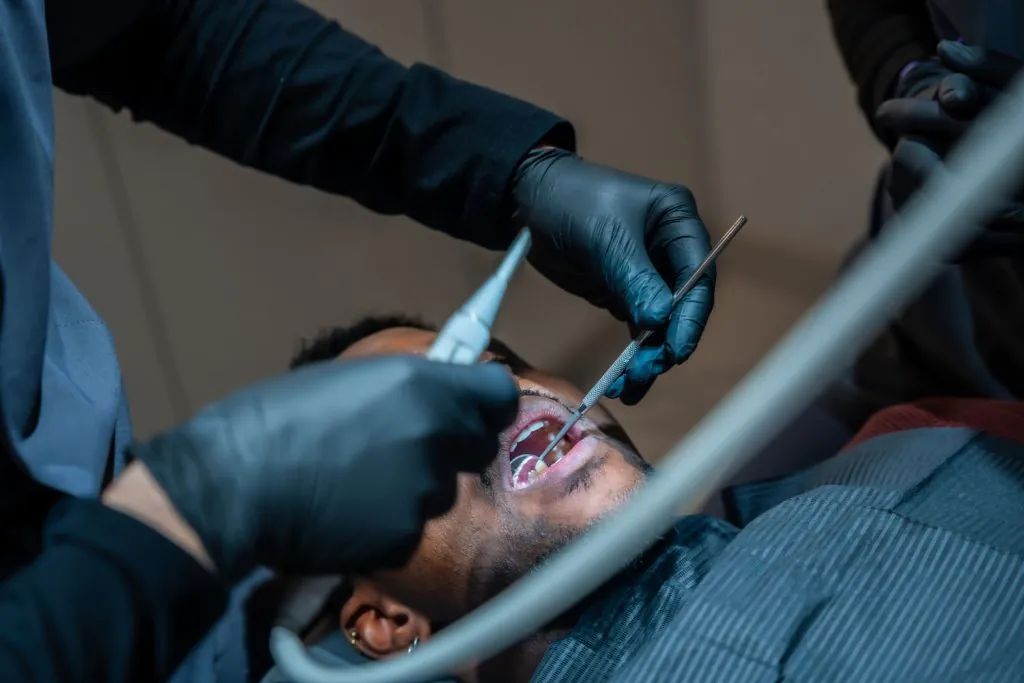 dentist performing dental checkup on patient in cl 2026 03 20 03 43 22 utc